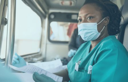 Nurse doctor sitting in mobile clinic with clipboard